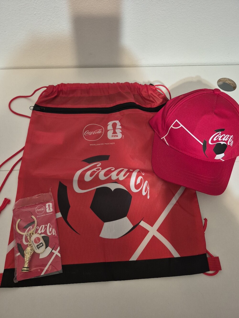 Coca Cola Red Drawstring Backpack Bag, Keychain and Cap Set with FIFA Soccer